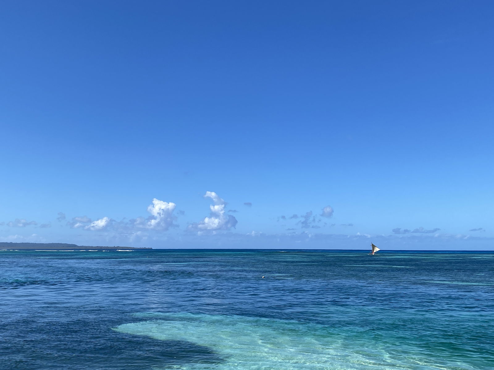 500 Sails canoe Anåguan sails out to CK Reef on Feb. 13 en route to Pika Fest on Tinian.