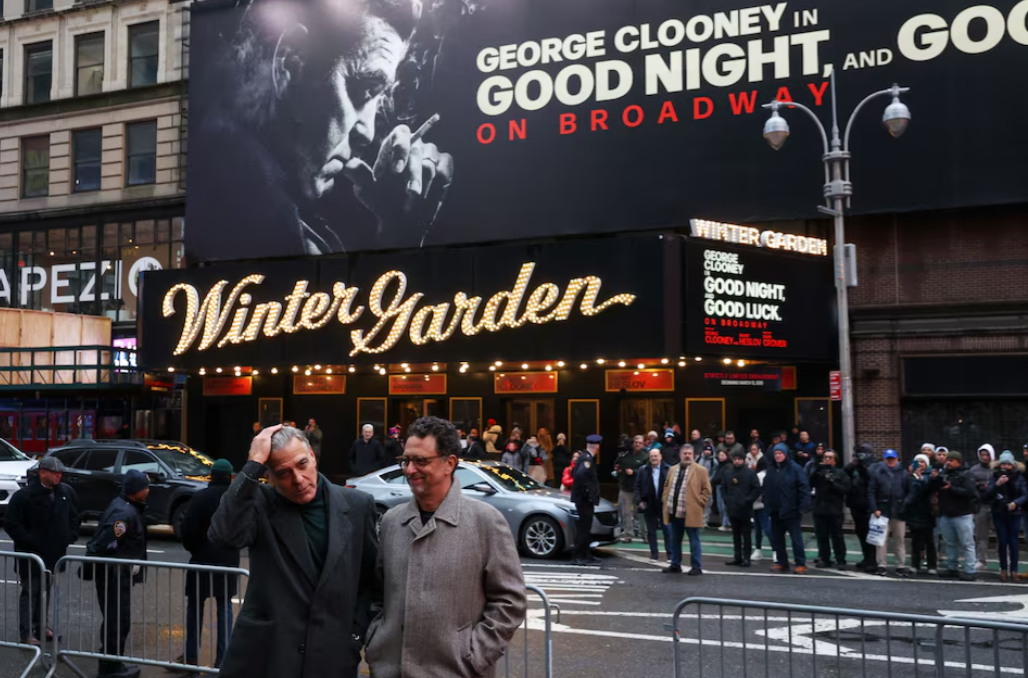 George Clooney poses with Grant Heslov ahead of his Broadway debut in “Goodnight and Goodluck” outside the Winter Garden Theater, in New York City, Feb. 6, 2025.