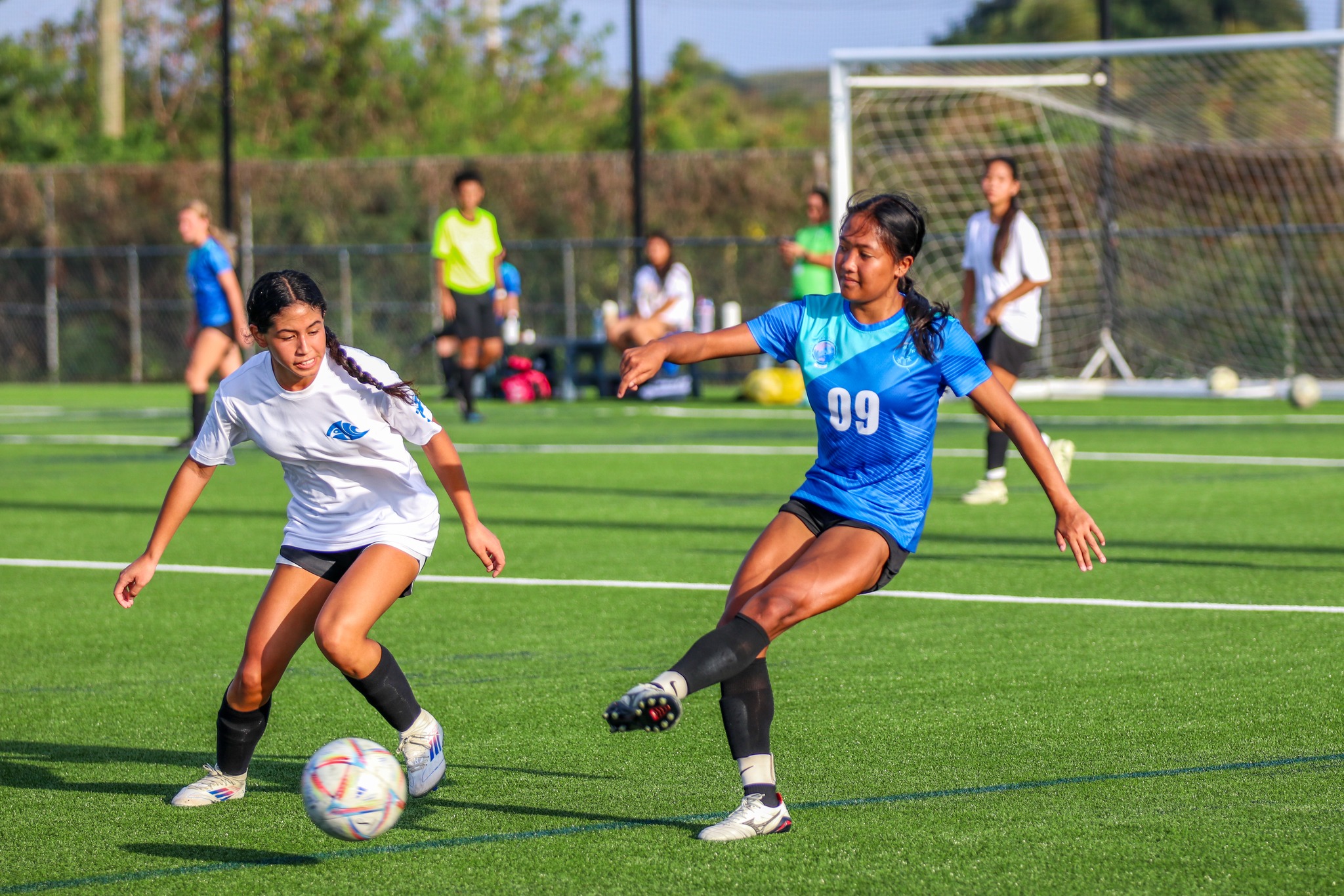 Saipan International School's Kaithlyn Chavez attempts a pass as a defender closes in during a match in the girls high school division of the PSS-NMIFA Interscholastic Soccer League SY24-25 at the NMI Soccer Training Center in Koblerville.NMIFA photo