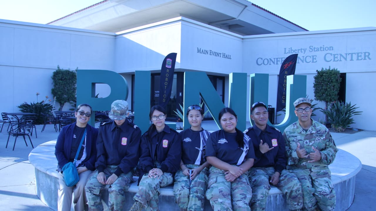 With their instructor, retired Sgt. First Class Albert Lujan, the Marianas High School Dolphins pose for photo during the 8th Brigade Robotics Competition in San Diego, California on Feb. 1, 2025.