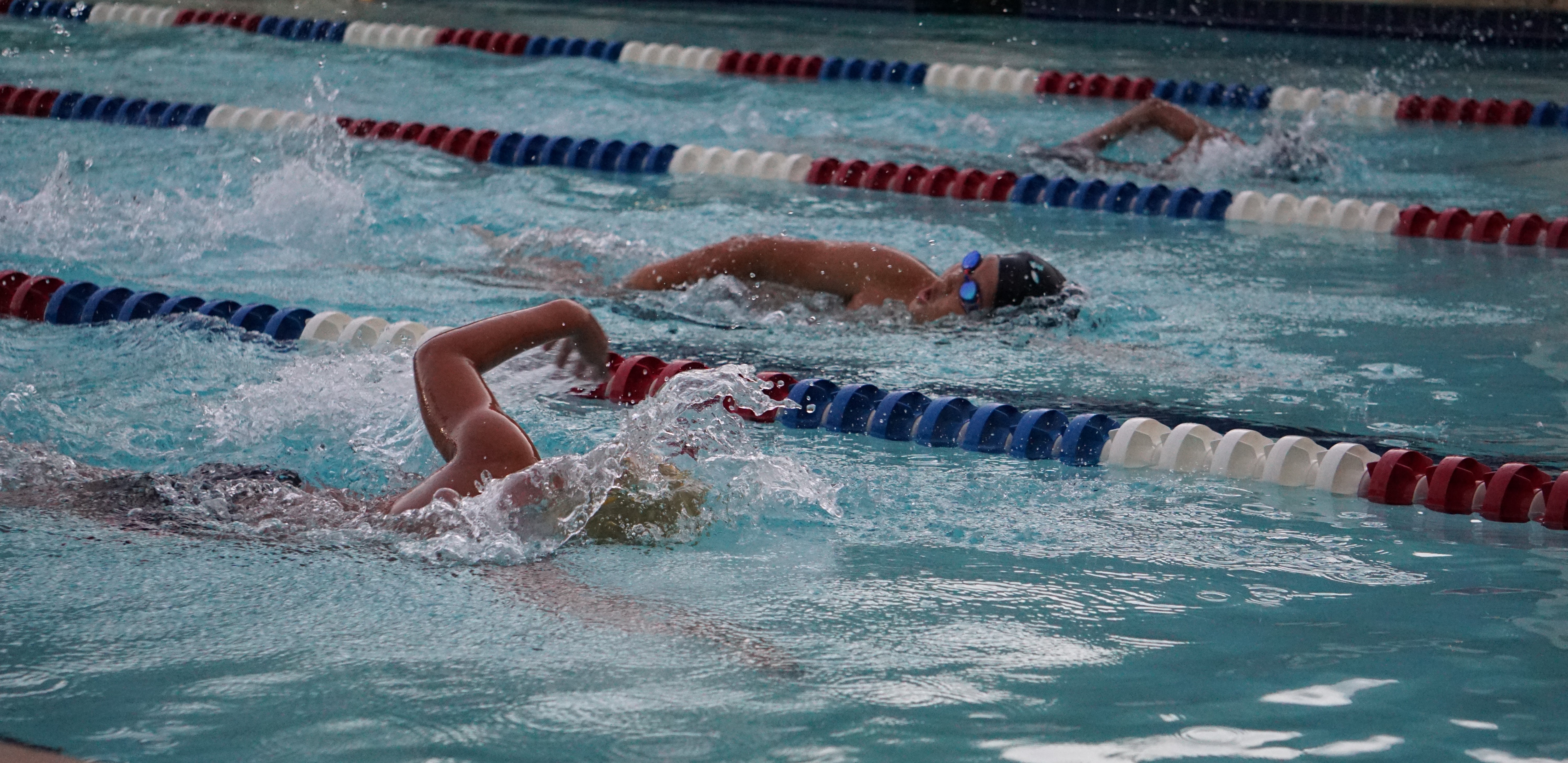 Leo Li, left, Dongmin Jang, and Lauren Camacho in action in the 50m freestyle event of the 9&10 age group of the Tsunami Cup Freestyle Junior Championships at the Pacific Islands Club Saipan on Saturday.