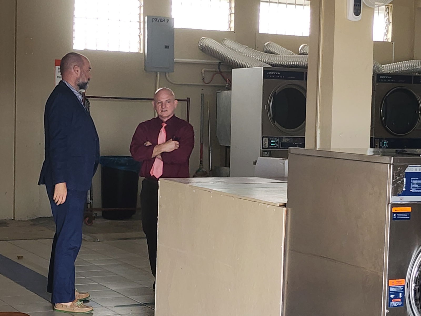 Defense attorney Joey Mcdoulett with investigator Jeremy Wolfe at Cool Laundry on Wednesday afternoon.