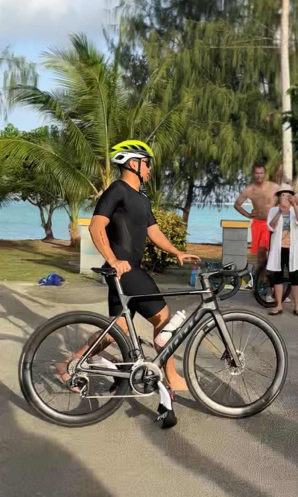 Christian Villacrusis makes his way to the bike portion of the first of a five-qualifier series for the 2025 Pacific Mini Games hosted by the Triathlon Association of the CNMI at Paupau Beach on Saturday.