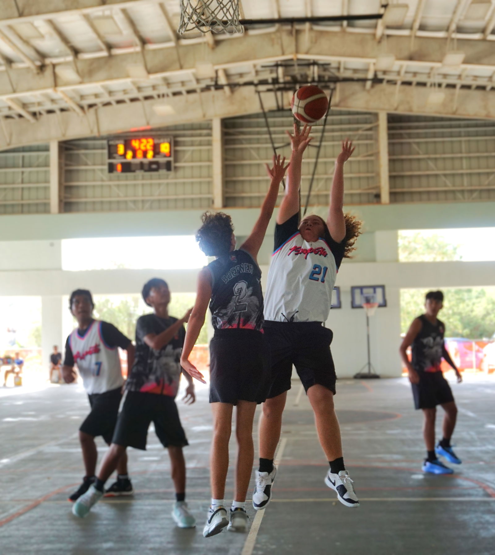 Prospect 2’s Steven Tudela takes the fadeway jumper over a defender during an NMIBF 2025 15U Basketball League game at the Koblerville gym on Saturday.Photos by James F. Sablan Jr.