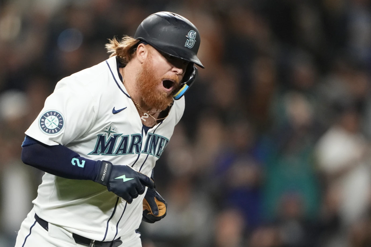  Seattle Mariners’ Justin Turner reacts to hitting a solo home run against the New York Yankees in the eighth inning of a baseball game on Sept. 18, 2024 in Seattle.
