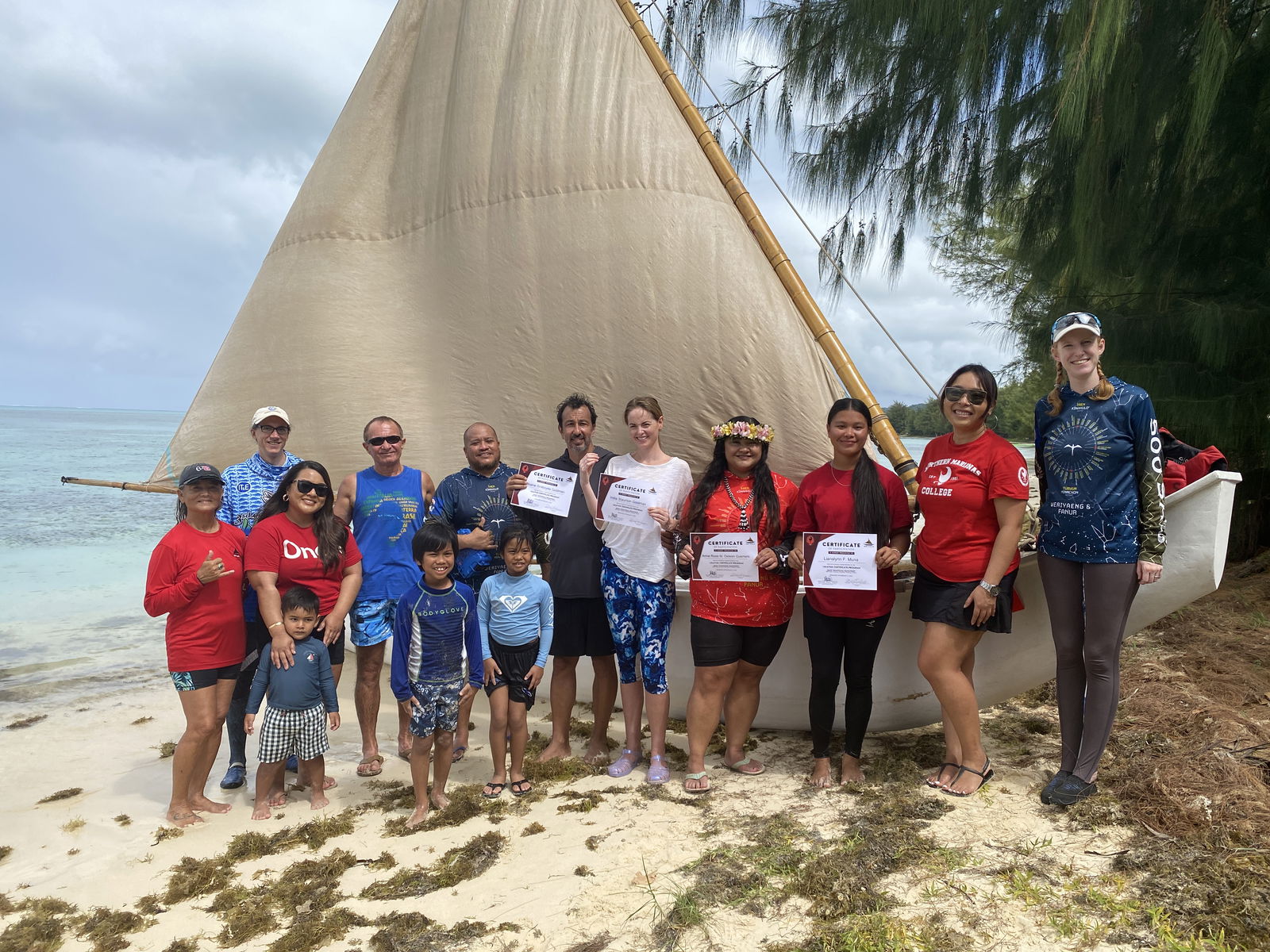 The four students who completed the Lalayak program — a 10-week-long Basic Traditional Seamanship course — pose for a photo with staff from 500 Sails and Northern Marianas College’s Community Development Institute. 