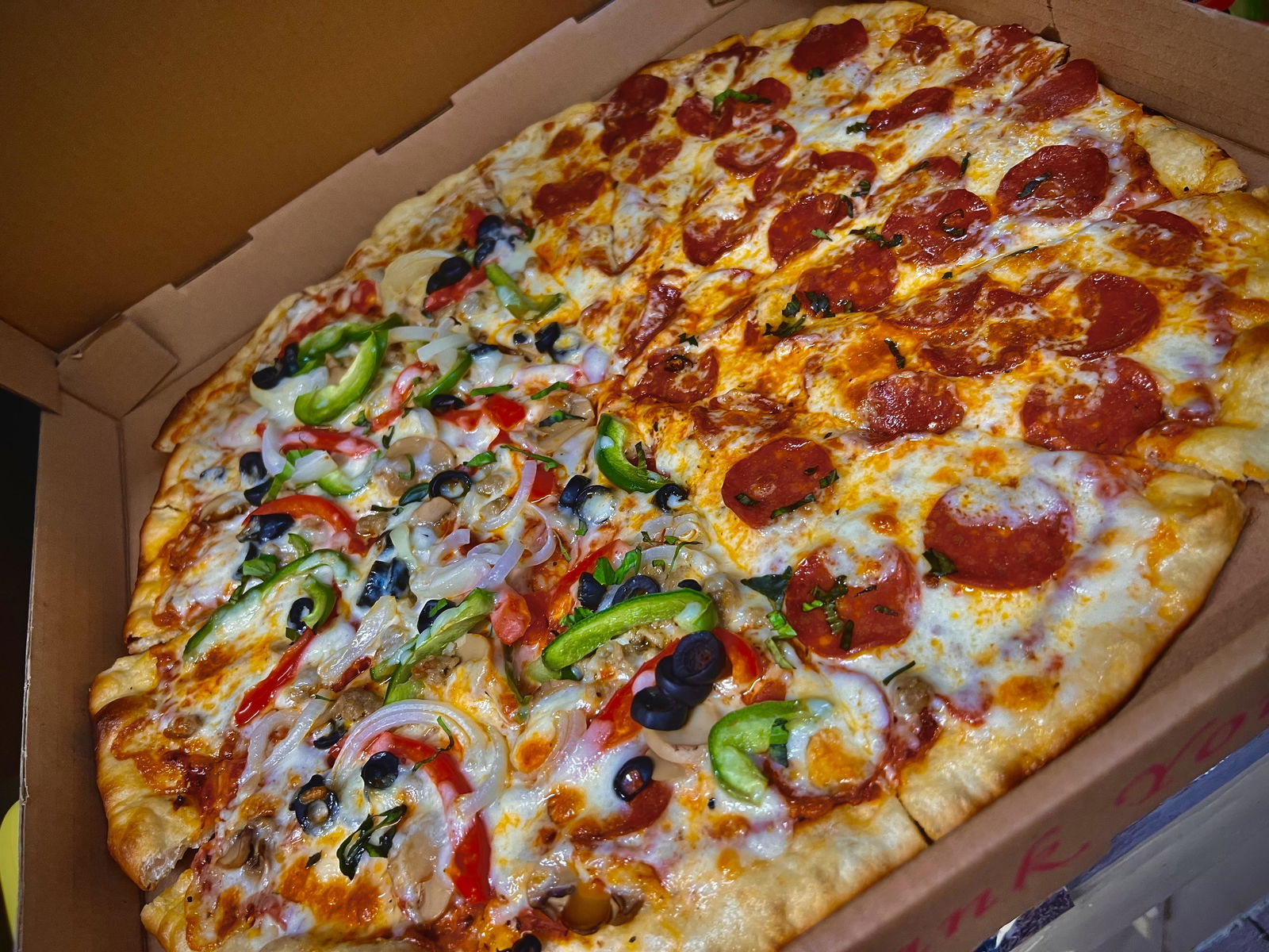 Lourdes Montemayor, Godfather's Bar manager, says their customers keep them busy with pizza orders.