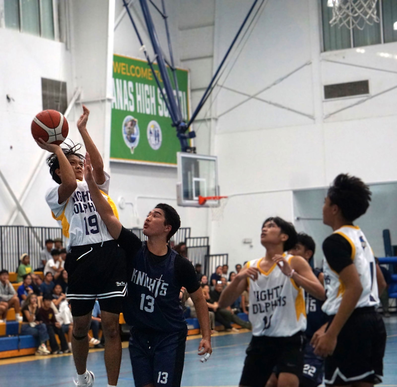 MHS Yellow’s Rafael Viesca gets fouled as he goes up for the shot during a game against MCS White in the boys high school division of the PSS-NMIBF Interscholastic Basketball League SY24-25 at the MHS gym.