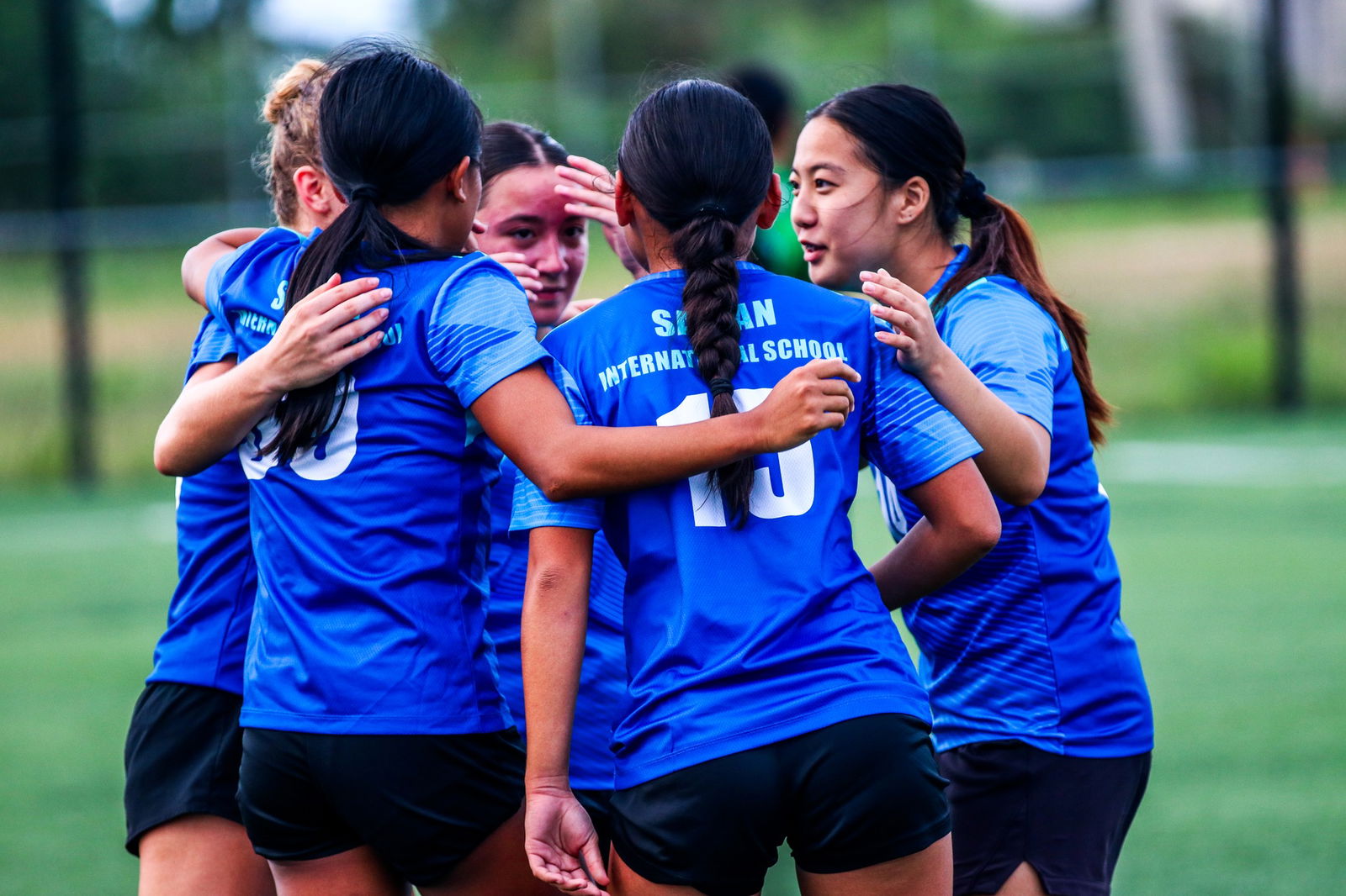 Saipan International School players huddle in celebration after scoring a goal during a girls high school division game of the PSS-NMIFA Interscholastic Soccer League SY24-25 at the NMI Soccer Training Center in Koblerville.