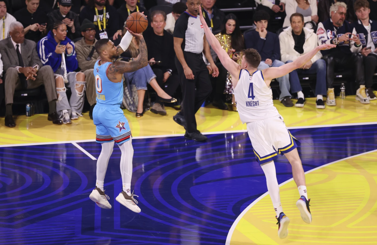 Milwaukee Bucks Damian Lillard shoots over Los Angeles Lakers forward Dalton Knecht during the NBA All-Star game Sunday, Feb. 16, 2025, in San Francisco.