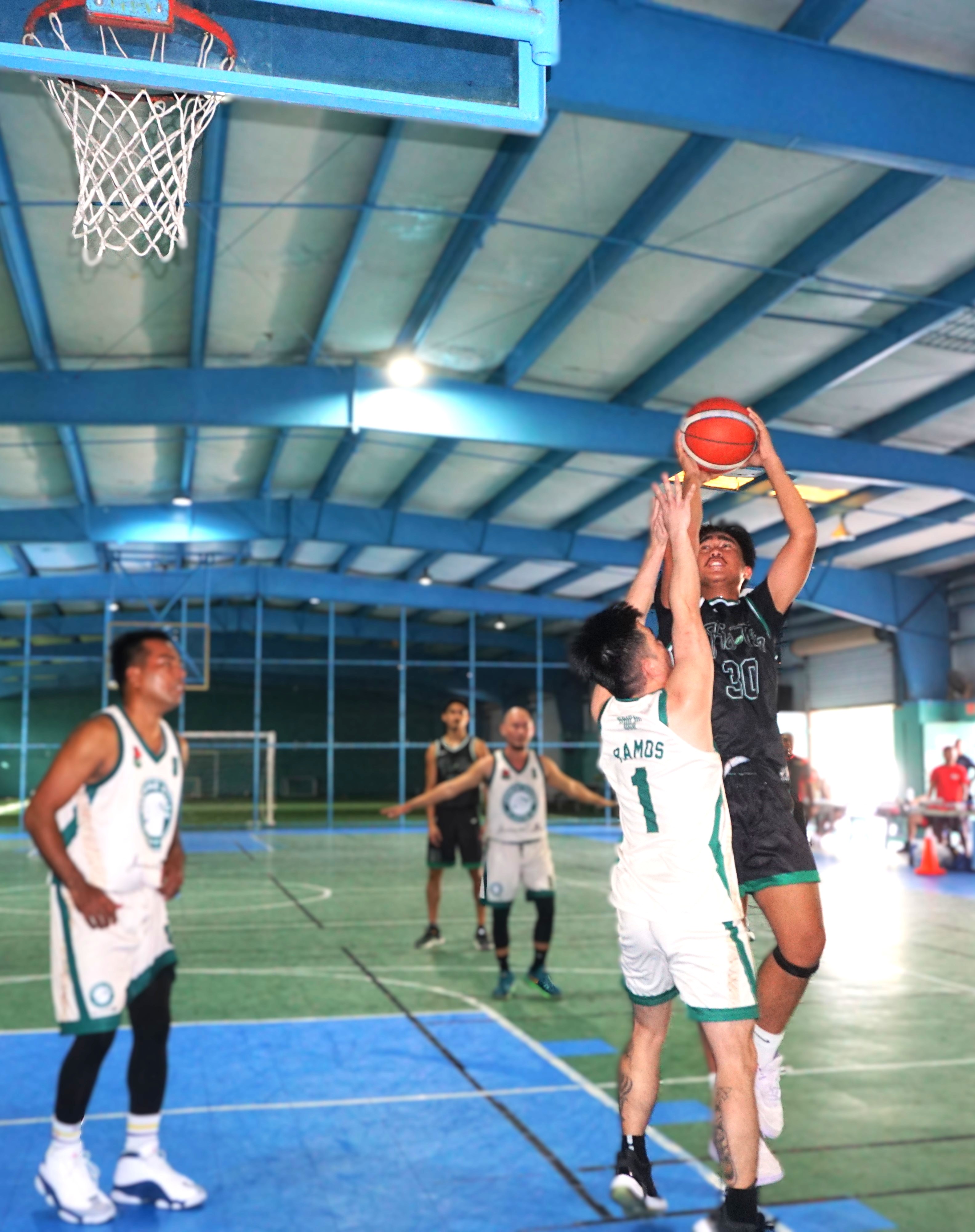 Pho Tam Restaurant's Kenny Laquian gets fouled as he goes up for the shot during a game against Jasmine House in the Alpha Kappa Rho 1st Semi-Open Invitational Basketball League 2025 at the TSL Sports Complex. 