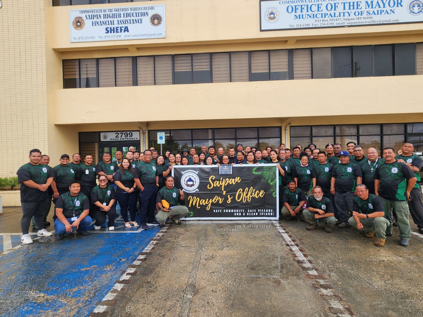 Saipan Mayor Ramon “RB” Camacho and his staffers pose for a group photo on Friday.