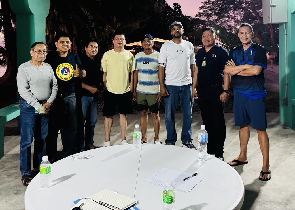 United Filipino Organization officers pose for a photo during a meeting to discuss the UFO Basketball League 2025.