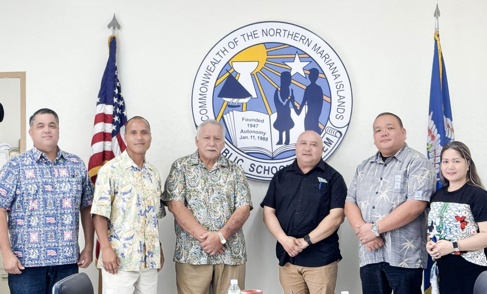 Commissioner of Education Dr. Lawrence F. Camacho, third right, poses for a photo with Senate Committee on Education and Youth Affairs Chair Ronnie Calvo, second left, House Committee on Education Chair Roman Benavente, third left, and Vice Chair Ralph Yumul, left, at the commissioner’s office on Capital Hill on Wednesday morning. Also in photo are Associate Commissioner for Administrative Services Eric Magofna, second right, and PSS Director of Finance Arlene Lizama, right. Benavente initiated the meeting as part of the Legislature’s outreach efforts to PSS.