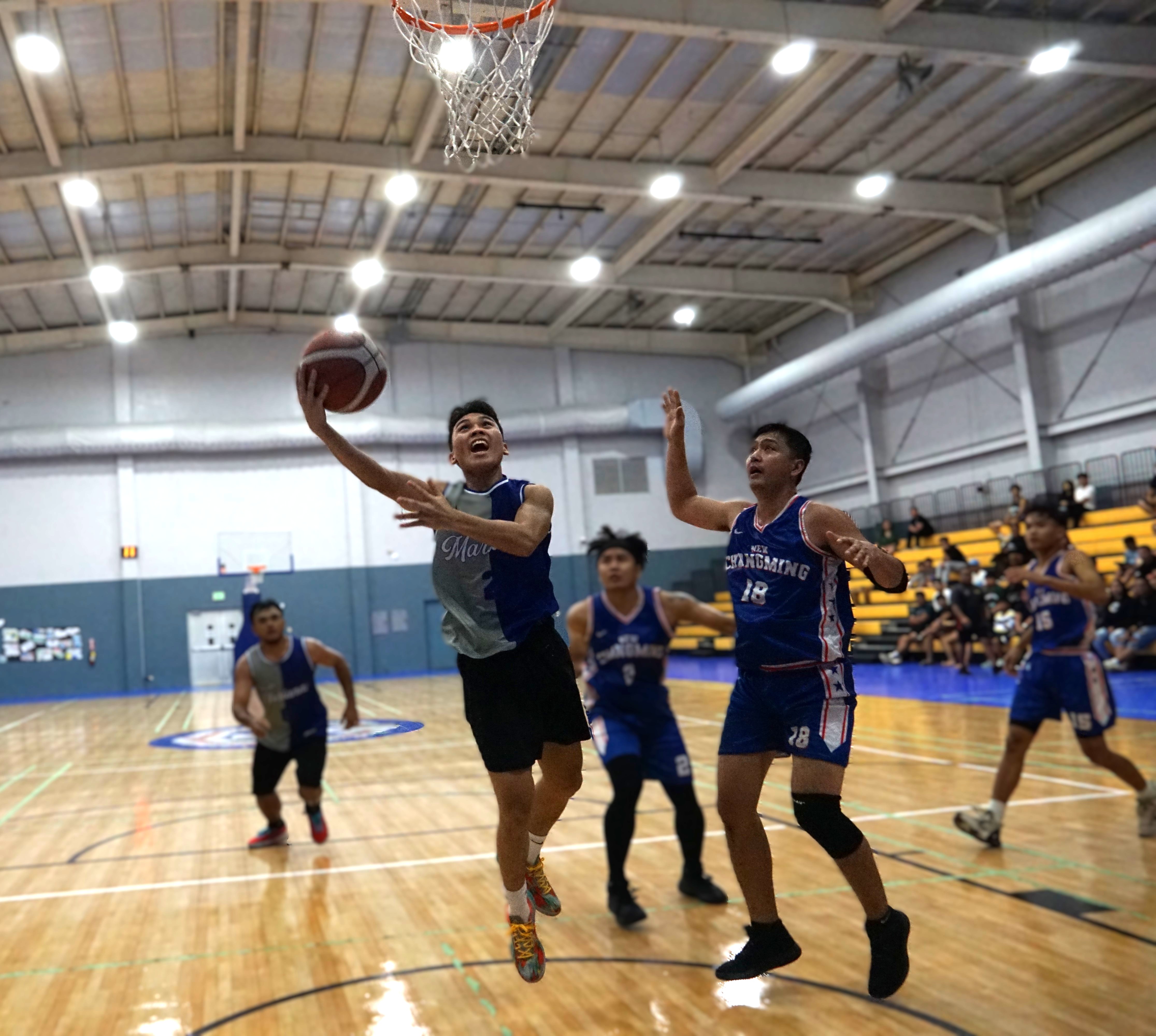 Team Marianas’ Lucio Aldan goes up for the finish against Changming during last season’s championship game of Michelob Ultra Cup at the Ada gym.Photo by James F. Sablan Jr.