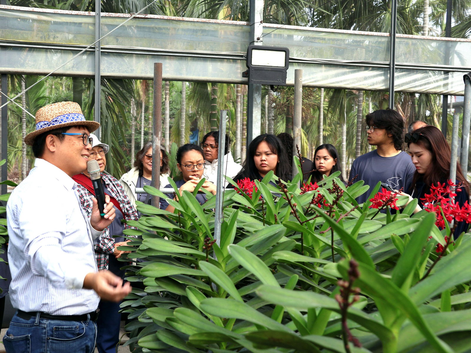 UOG students Chloe Santos and Grace Anne Dela Cruz listen to a tour guide at the Angel Garden Leisure Farm, an educational and recreational agritourism business in Pingtung County, Taiwan.