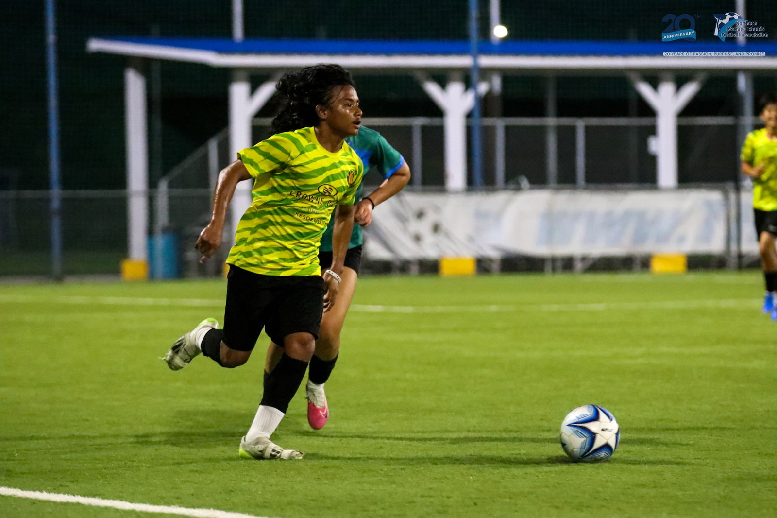 Matansa’s Jayvin Bisek looks on as he pushes the ball forward during a game against the Women's Development Team in the U17 boys division of the TakeCare Youth Soccer League Spring 2025 at the NMI Soccer Training Center in Koblerville.NMIFA photo