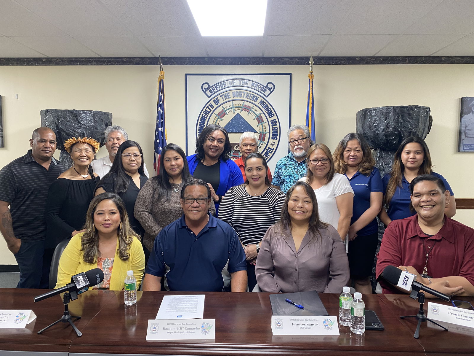 Members of the Liberation Day Committee board and other volunteers pose with Saipan Mayor RB Camacho.