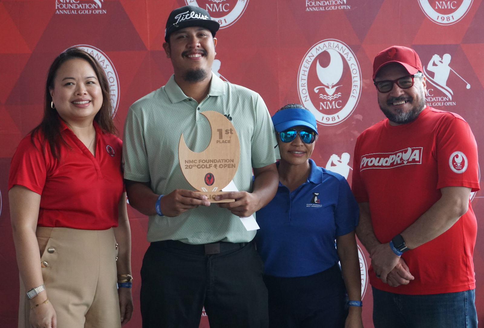 Keith Kintol, 2nd left, poses with the B Flight trophy of the 20th Annual NMC Foundation Golf Open at LaoLao Bay Golf & Resort.Photo by James F. Sablan Jr.