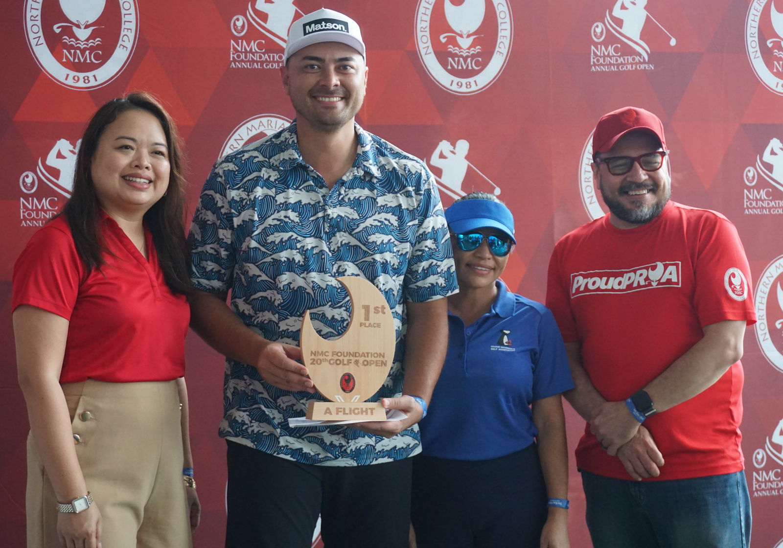 Stephen Gatewood, 2nd left, poses with the A Flight trophy of the 20th Annual NMC Foundation Golf Open at LaoLao Bay Golf & Resort.Photo by James F. Sablan Jr.