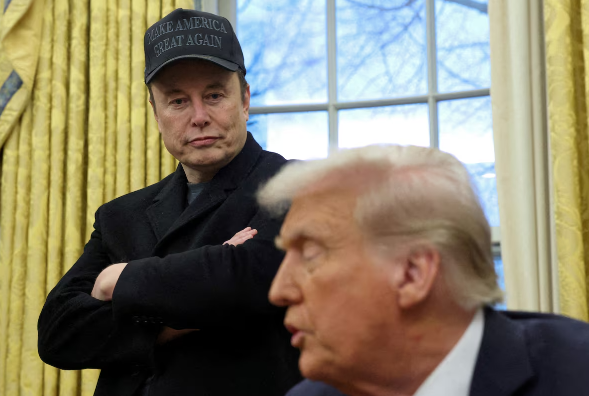Elon Musk listens to President Donald Trump speak in the Oval Office of the White House in Washington, D.C., Feb. 11, 2025.REUTERS