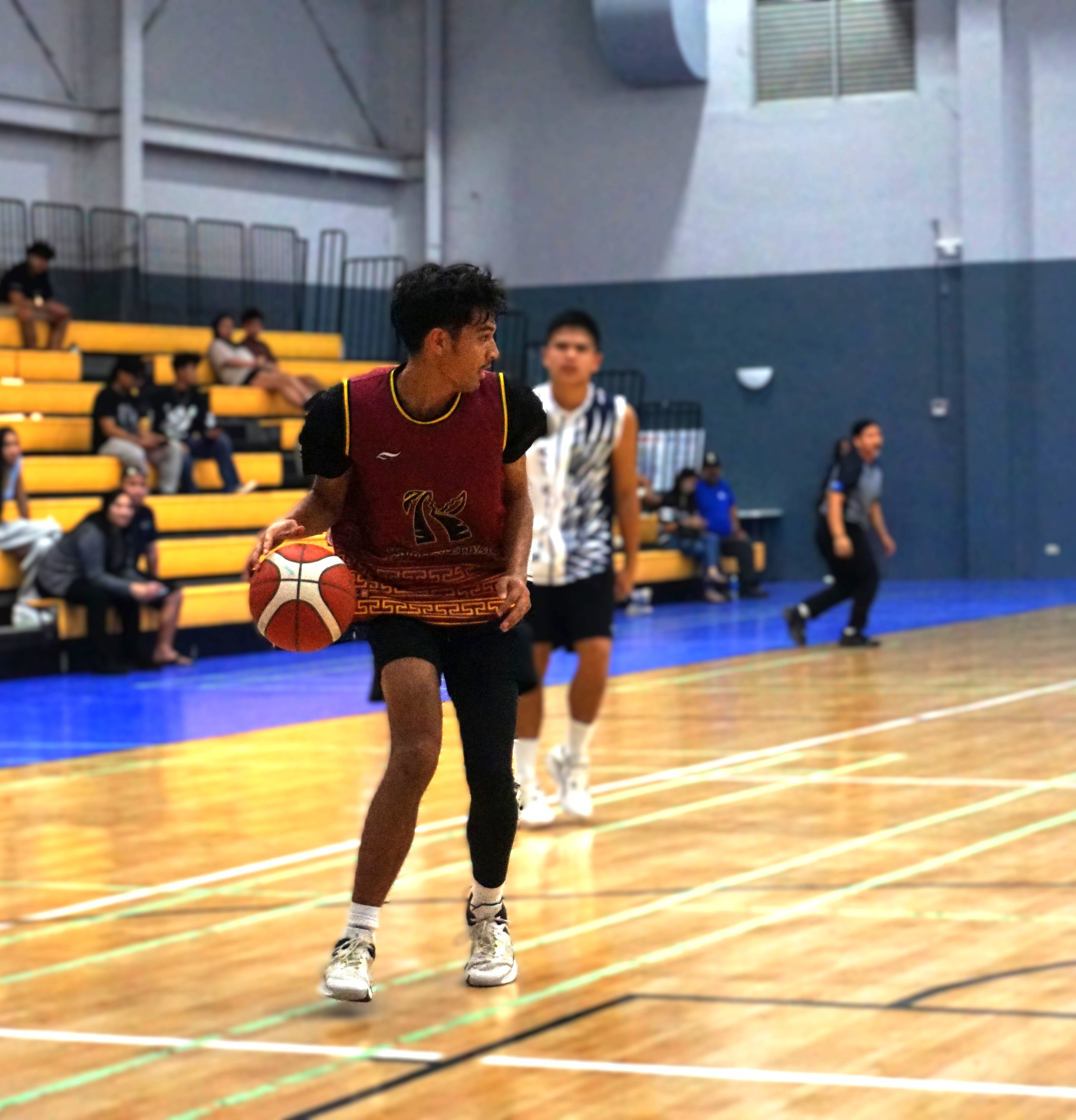 Kagman High School V's Ibrahim Ibarola secures the possession after a defensive rebound against Grace Christian Academy during a boys high school division game of the PSS-NMIBF Interscholastic Basketball League SY24-25 at the Ada gym on Wednesday.Photo by James F. Sablan Jr.