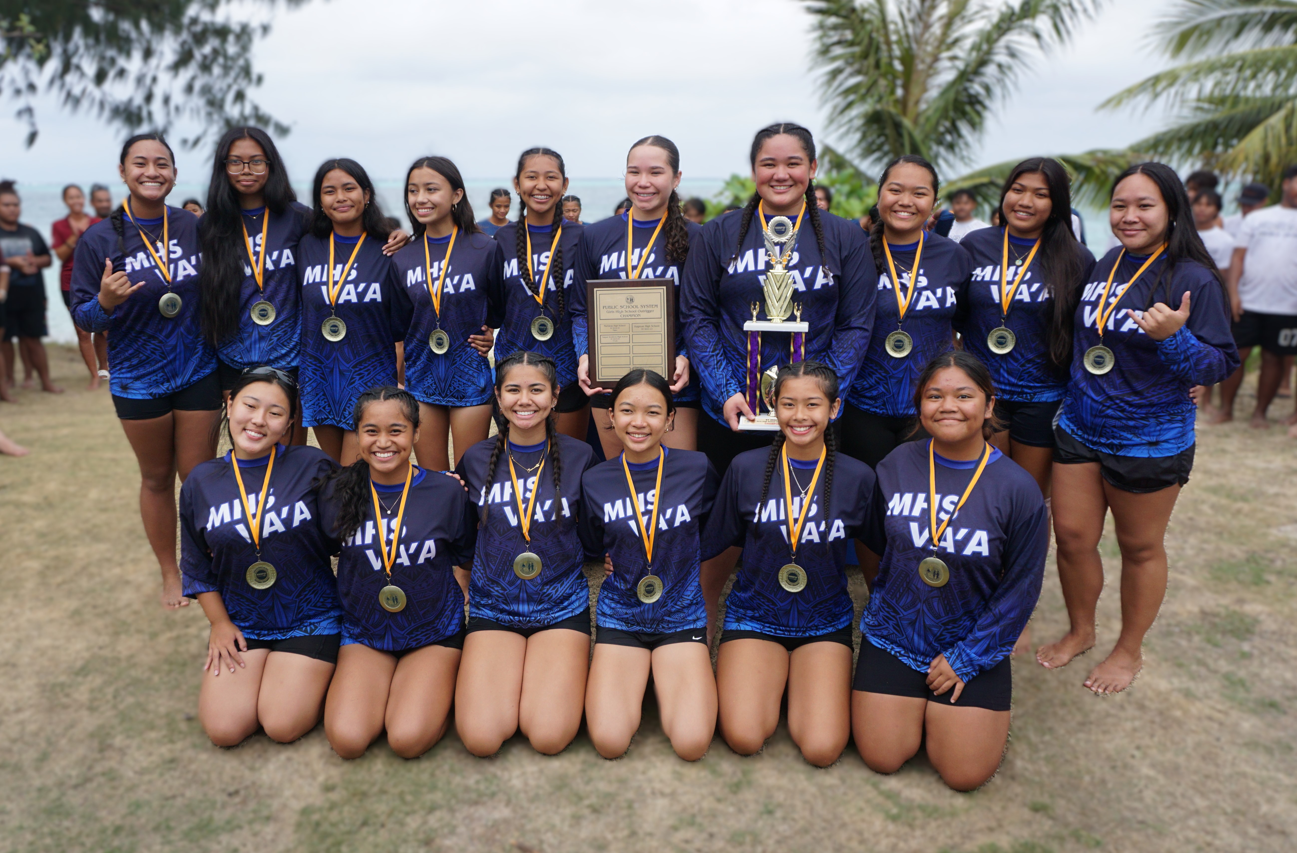 The Marianas High School girls team members pose for photo with the girls division championship trophy during the awards ceremony of the PSS-NMNPSF Interscholastic Outrigger Race Series SY24-25 on Saturday at Kilili Beach.Photo by James F. Sablan Jr.