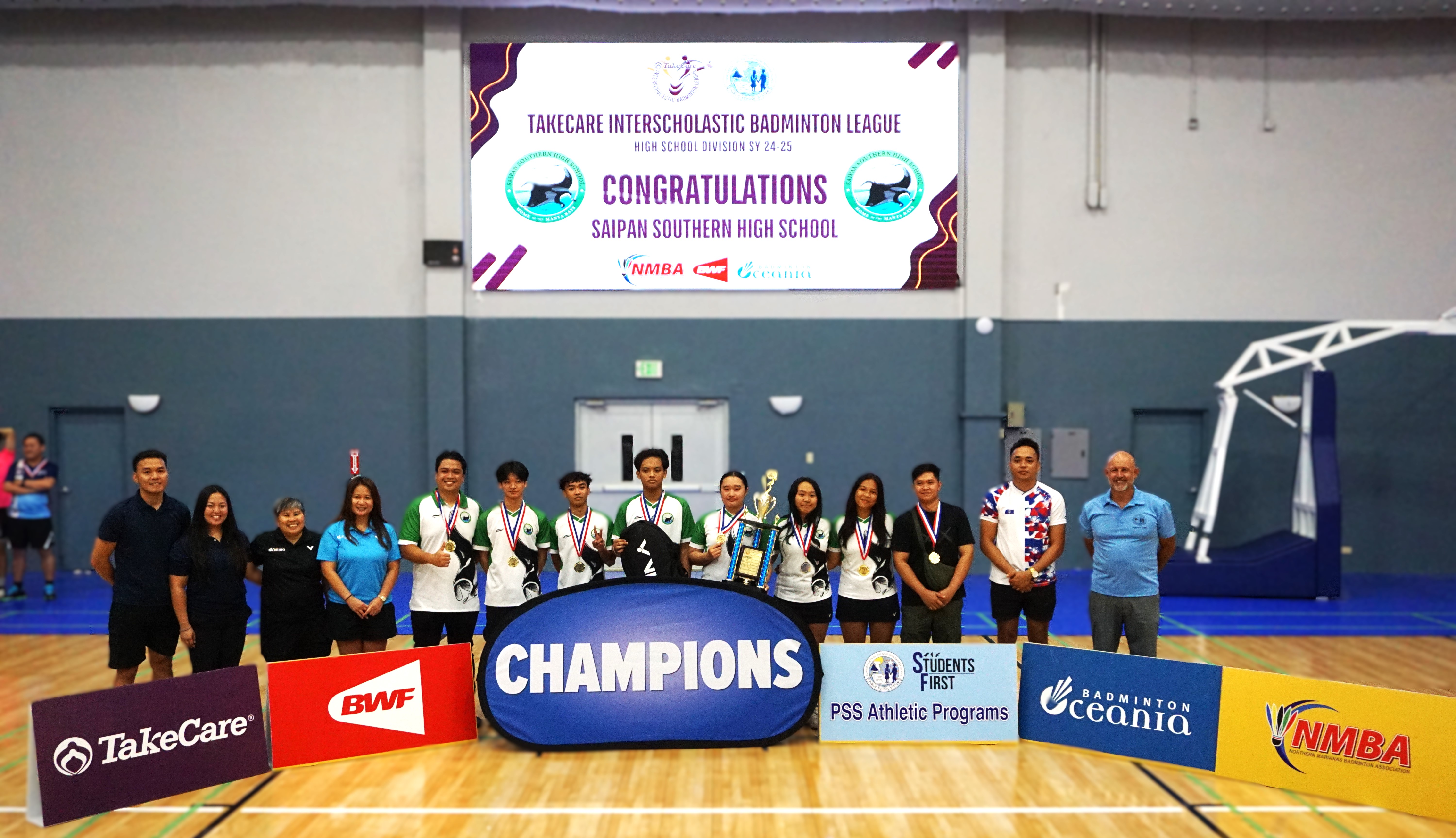 Saipan Southern High School 1 players pose for a photo with the Northern Marianas Badminton Association board members and PSS Athletic Director Nick Gross after winning the high school division championship of the PSS-NMBA Interscholastic Badminton League SY24-25 at the Ada gym on Saturday.Photo by James F. Sablan Jr.