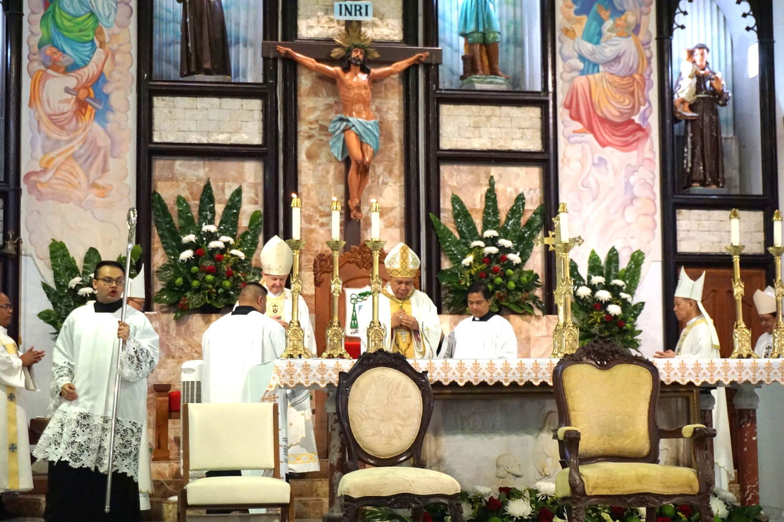 Bishop Romeo Convocar in prayer during the ceremony.