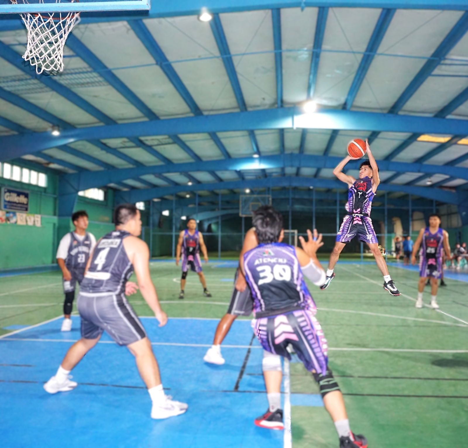 Yuman Construction’s Sean Licayan takes the fadeaway jump shot during a playoff game against Hoop Academy in the Alpha Kappa Rho 1st Semi-Open Invitational Basketball League 2025 at the TSL Sports Complex on Sunday.Photo by James F. Sablan Jr.