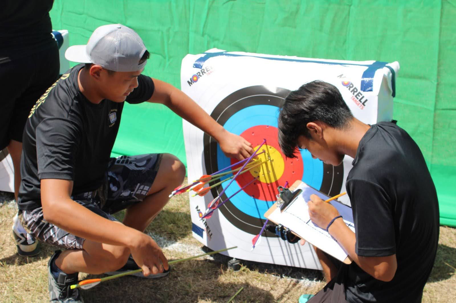 C/SGT Ying Zhang and C/PV1 Conrad Iba score themselves.