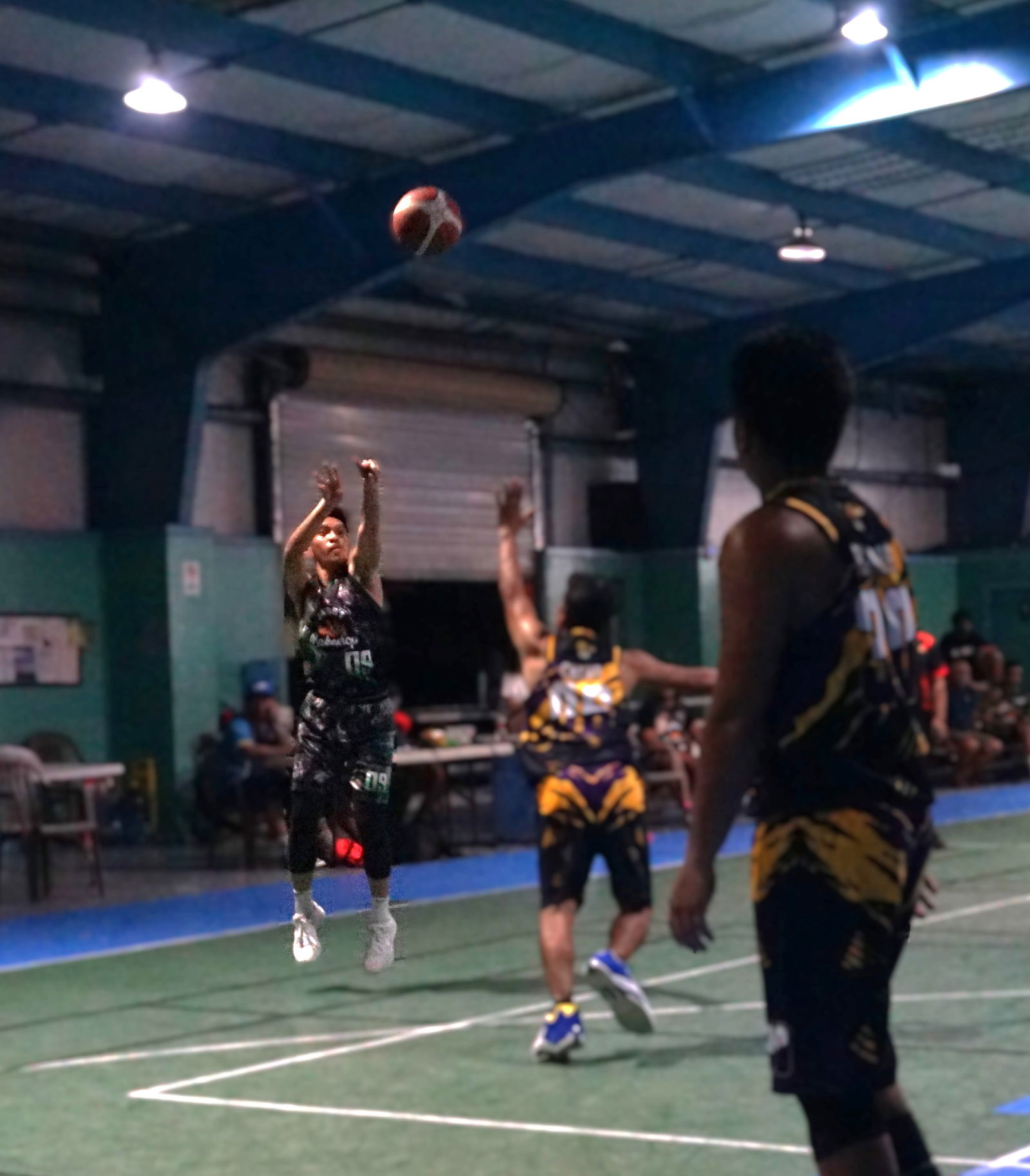 Irvyn Malonzo of Jacob Bakery takes a contested three-pointer during a game in the Alpha Kappa Rho 1st Semi-Open Invitational Basketball League 2025 at the TSL Sports Complex.Photo by James F. Sablan Jr.