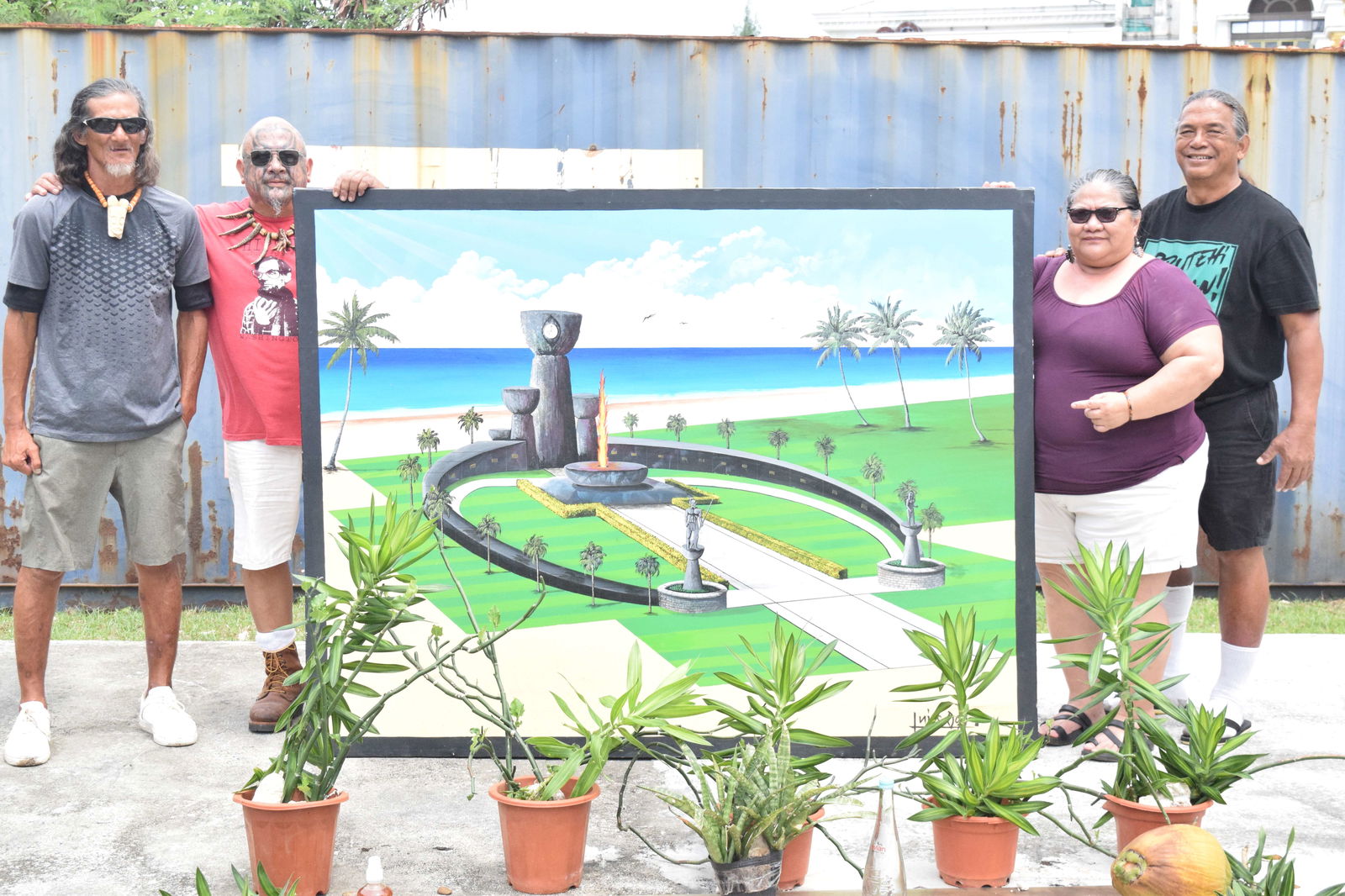 Matua Council for Native Chamorro Advancement President Liana S. Hofschneider, second right, with her husband Richard Hofschneider, right, Herman Tudela, left, and volunteer, Raymond "Bo" Quitugua, display an artist’s rendition of a "respectable, more dignified" reburial facility for the remains of their Chamorro ancestors at the back of the unfinished Imperial Pacific International building in Garapan.Photo by Emmanuel T. Erediano