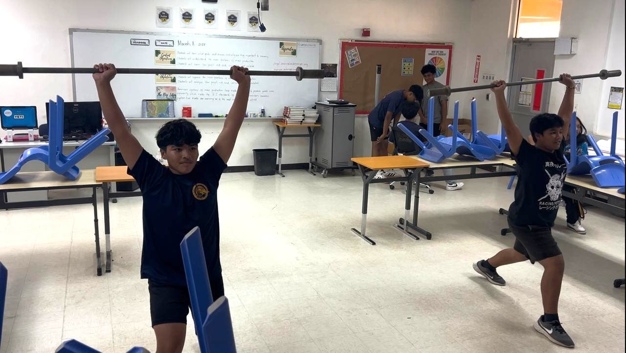 Izaiah Tenorio and Kaizaeah Remoket synchronize the Split Jerk during a training session of the HD Weightlifting Academy CNMI’s grassroots program under Hopwood Middle School.