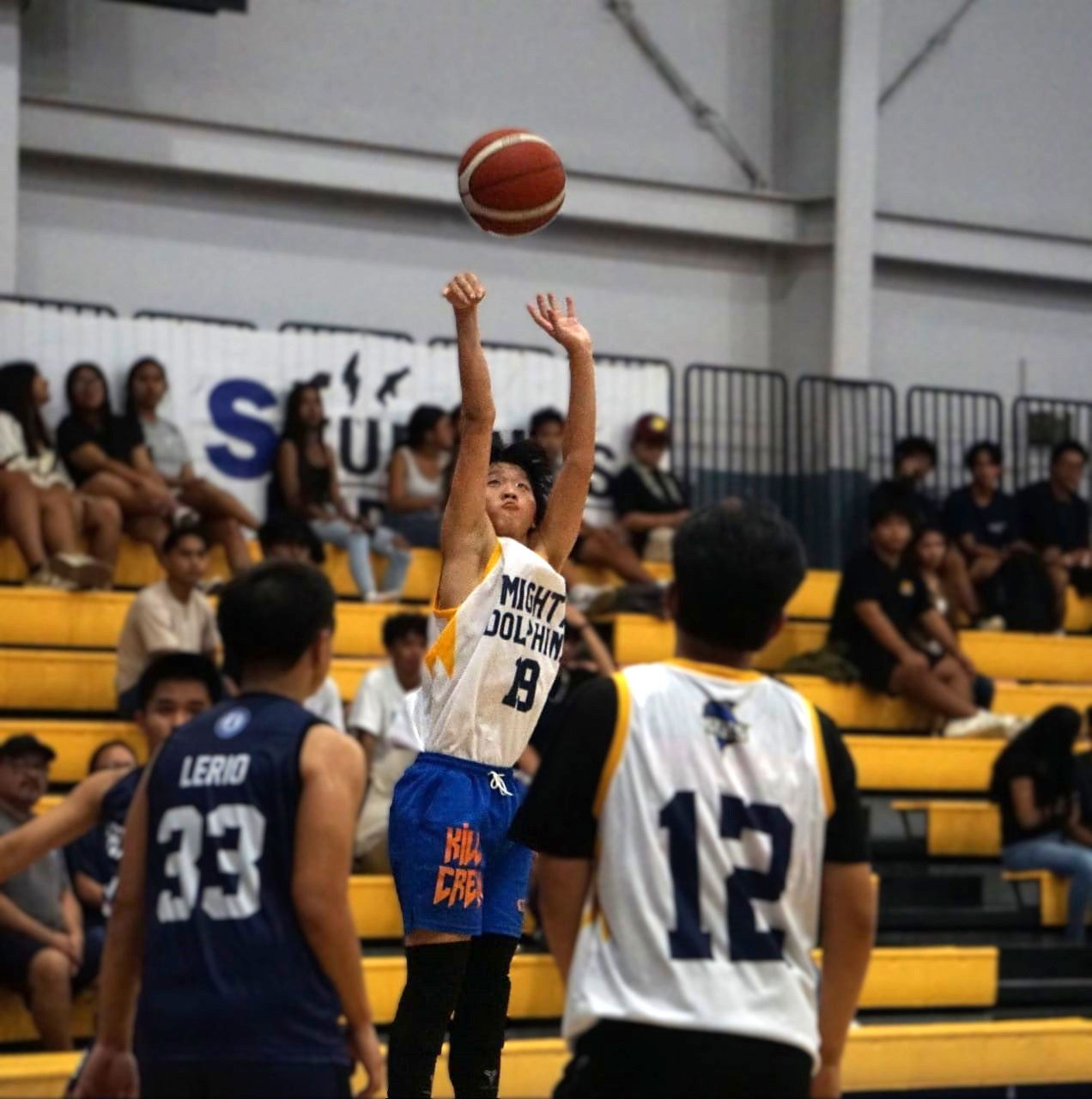 Marianas High School’s Elijah Ye pulls up for a three-point shot during a game against Mount Carmel School in the boys high school division of the PSS-NMIBA Interscholastic Basketball League SY24-25 at the Ada gym.Photo by James F. Sablan Jr.
