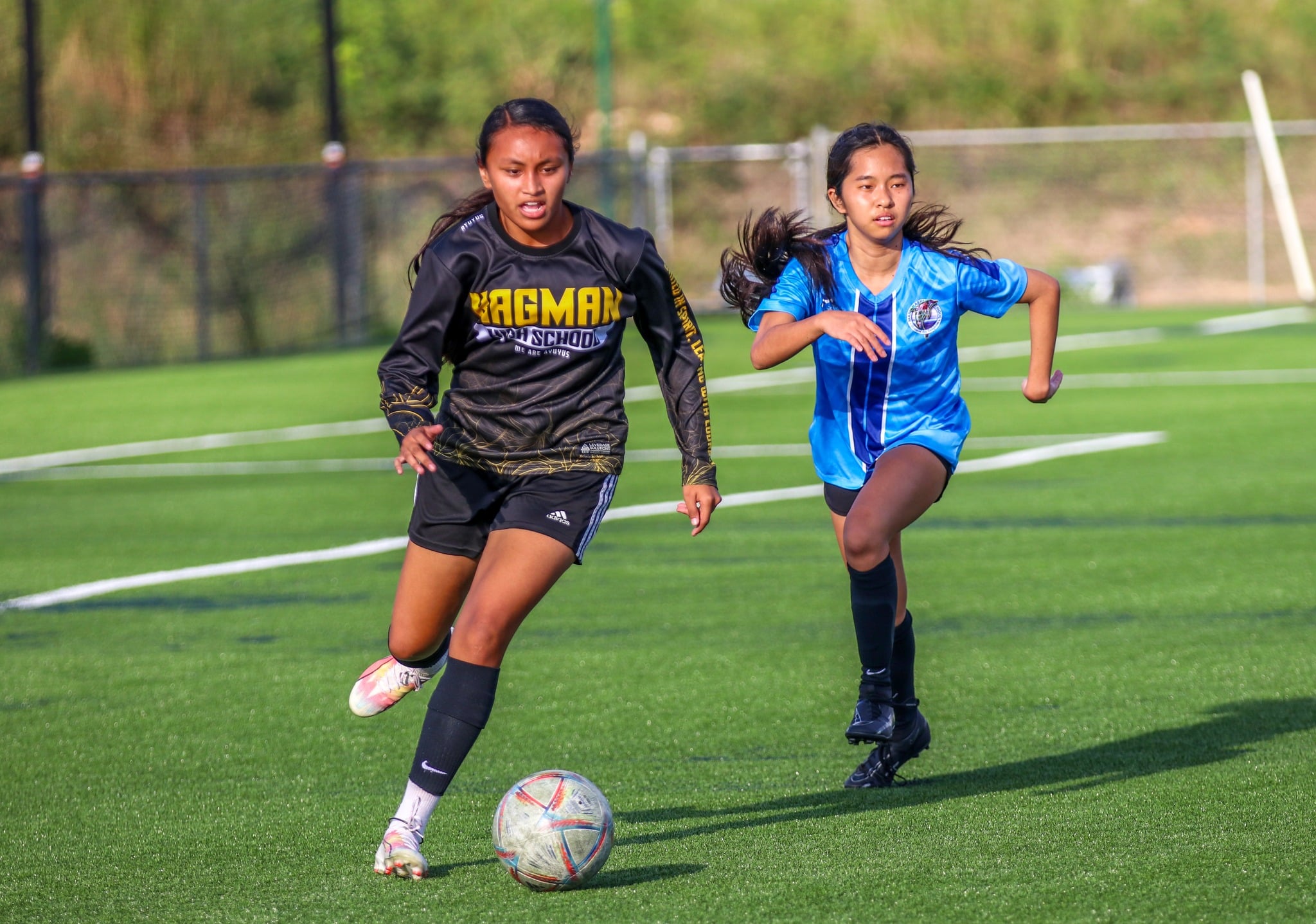Players of Kagman High School and Marianas High School chase after the ball during a match in the girls high school division of the PSS-NMIFA Interscholastic Soccer League SY24-25 at the NMI Soccer Training Center in Koblerville.