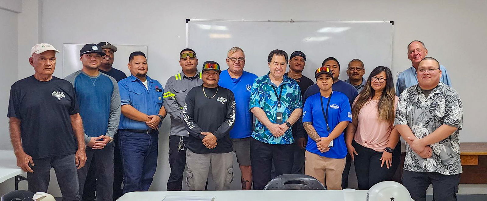 From left, Jesus Quitano, trades supervisor; Jay Rideb; Benji Yorormad; Joelourd Cepeda; Eddie Guzman; Glenn Manglona; Harry “Spike” Speicher, PLT-certiﬁed instructor; Kevin Watson, MPA, CUC Executive Director; Jimmy Manalo; Jessica Mundo; Rodney Taisacan II; Lee Lieto, power division manager; Vanessa Fitial, human resources generalist; Clay Williams, training & development coordinator; and Francisco Matsunaga, human resources manager. Not pictured: Graduates Nardin Lizama, Nicialynn Cabrera, and Collin Duenas.CUC photo