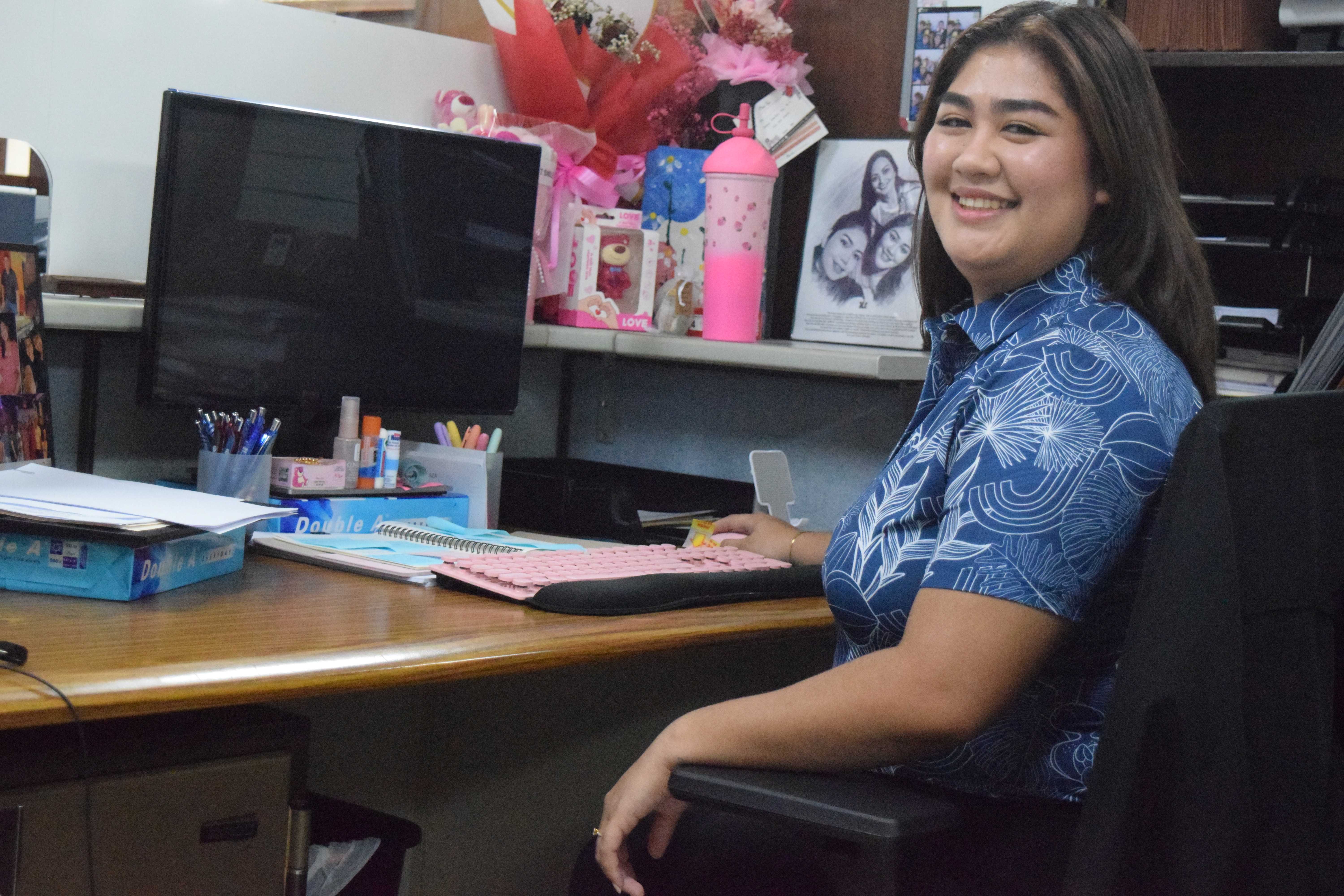 Triple J Saipan Inc. HR  specialist Jorianne Cabrera at her desk.