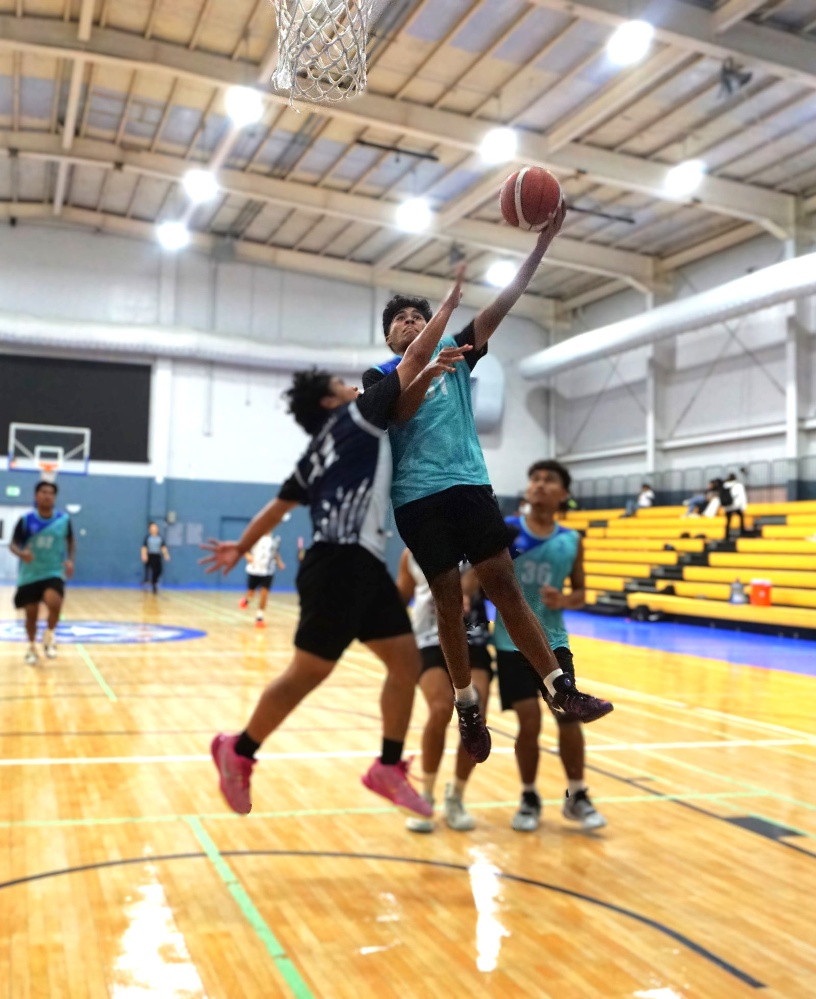SIS’ Theo Joab gets fouled as he goes up for the finish during a game against GCA in the boys high school division of the PSS-NMIBF Interscholastic Basketball League SY24-25 at the Ada gym on Wednesday.Photos by James F. Sablan Jr