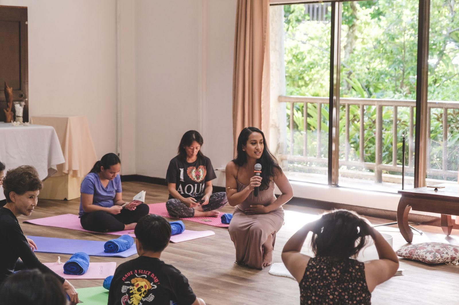 Asia Hilario speaks at a local sound healing event she hosted.