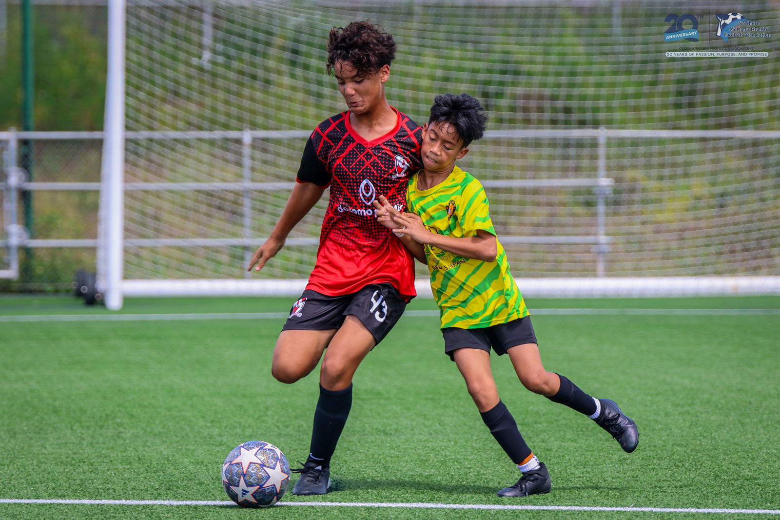 Paire and Matansa players battle for possession during a U14 boys division game of the TakeCare Youth Soccer League Spring 2025 at the NMI Soccer Training Center in Koblerville on Saturday.NMIFA photo