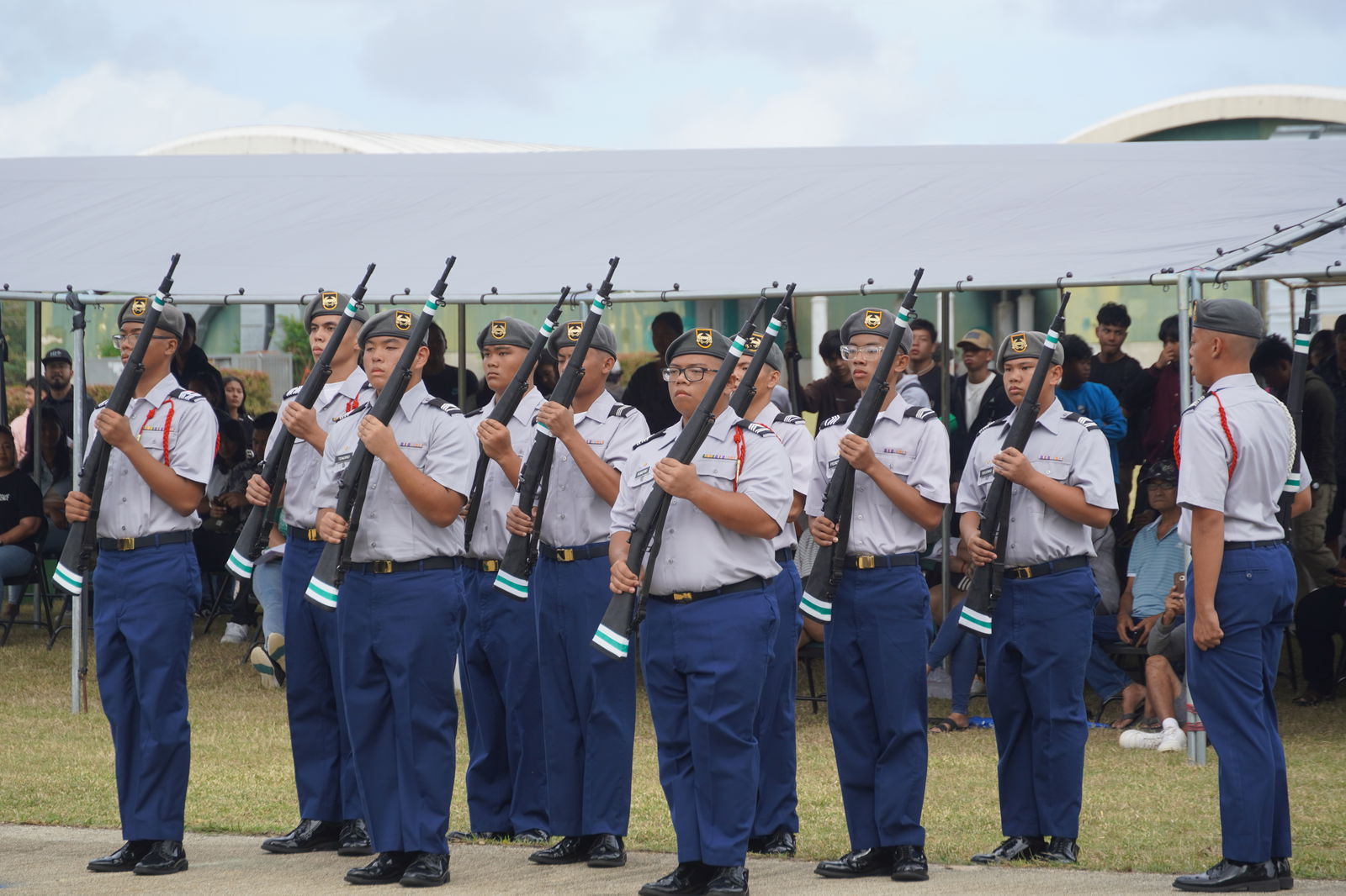 Armed drill team members in action. 
