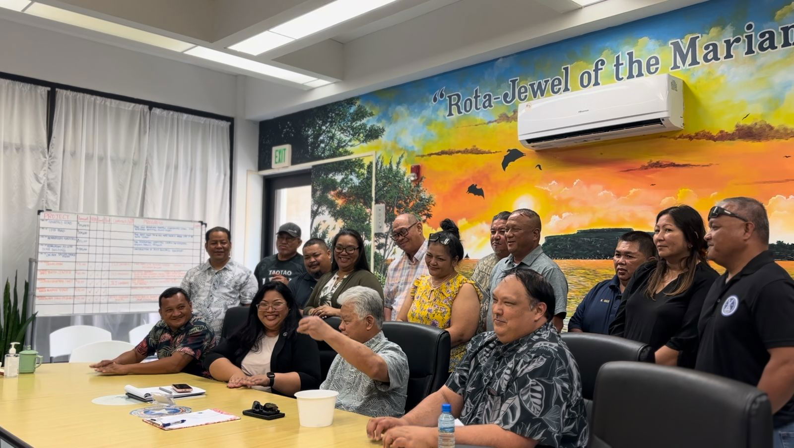Gov. Arnold I. Palacios picks a piece of paper bearing the name of the lucky resident who would be the first recipient of the Commonwealth Assistance for Renewable Energy's residential solar grant during a raffle draw at the Rota Mayor's Office on Friday last week. in the picture are Rota Mayor Aubry Hocog, second left, and Office of Grants Management-State Clearinghouse Administrator Epi Cabrera, right. Contributed photo
