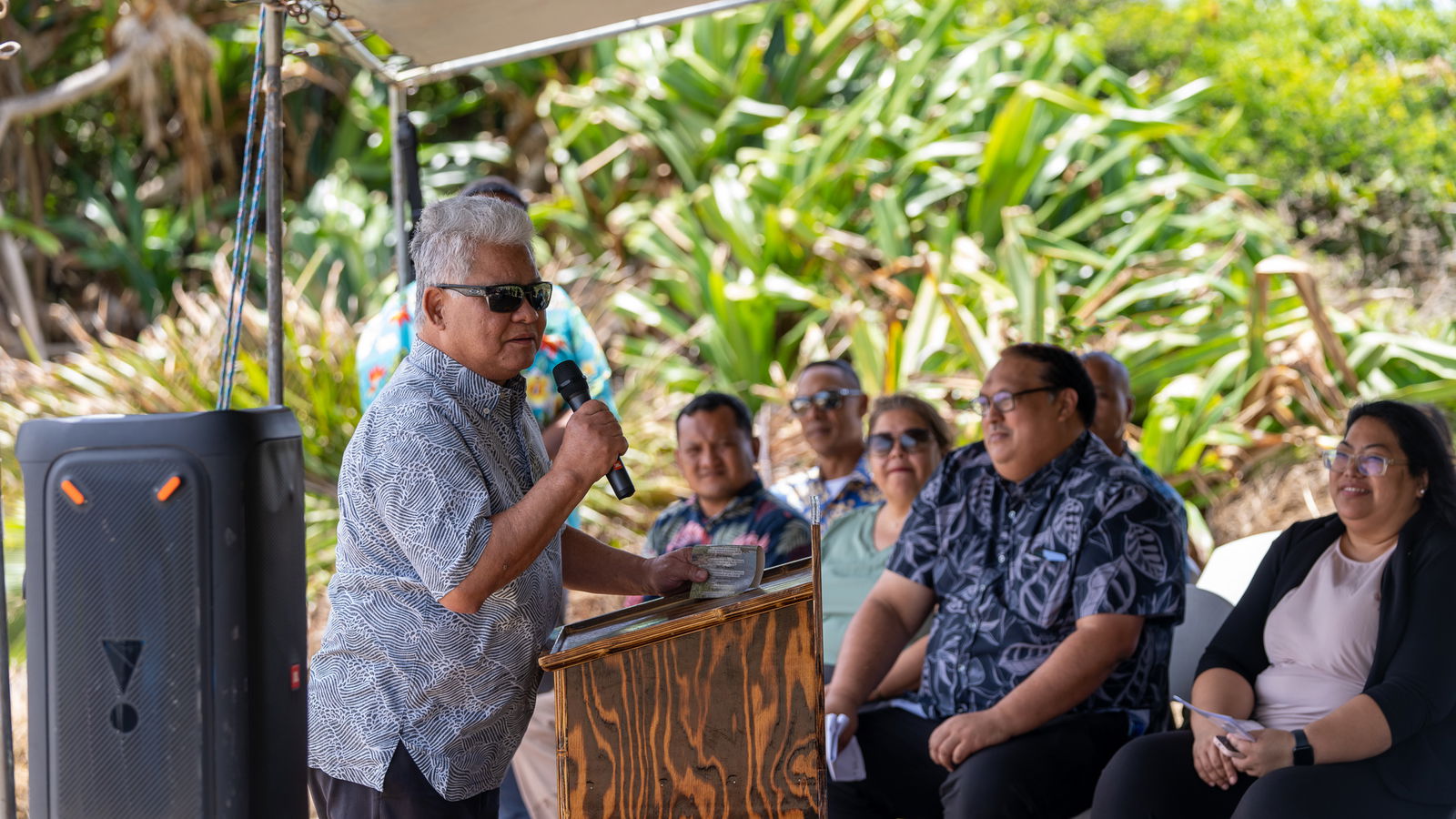 Gov. Arnold I. Palacios delivers his remarks, as Rota Mayor Aubry Hocog, right, Office of Grants Management & State Clearinghouse Administrator Epi Cabrera and other officials listen during the groundbreaking ceremony for the Pona Point Cliff Fishing and Railing Project on Friday.
