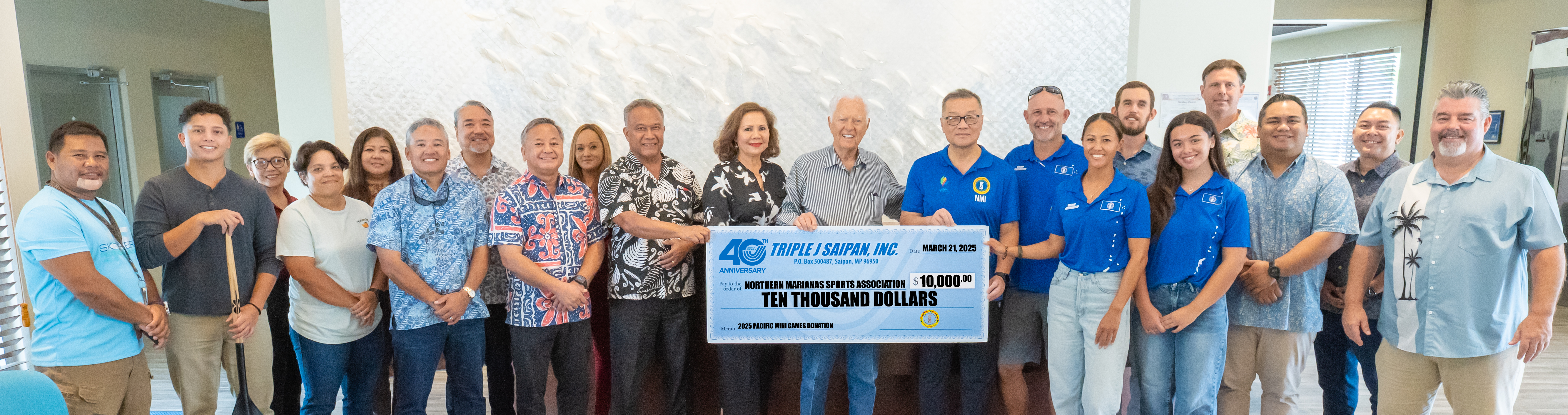 Triple J Chairman Bob Jones, Mrs. Pilar Jones, and Triple J managers present $10,000 to NMSA Chairman Jerry, NMSA Board Members, and Team Marianas at the Saipan Surfrider Resort Hotel in Chalan Kanoa, Saipan.Contributed photo