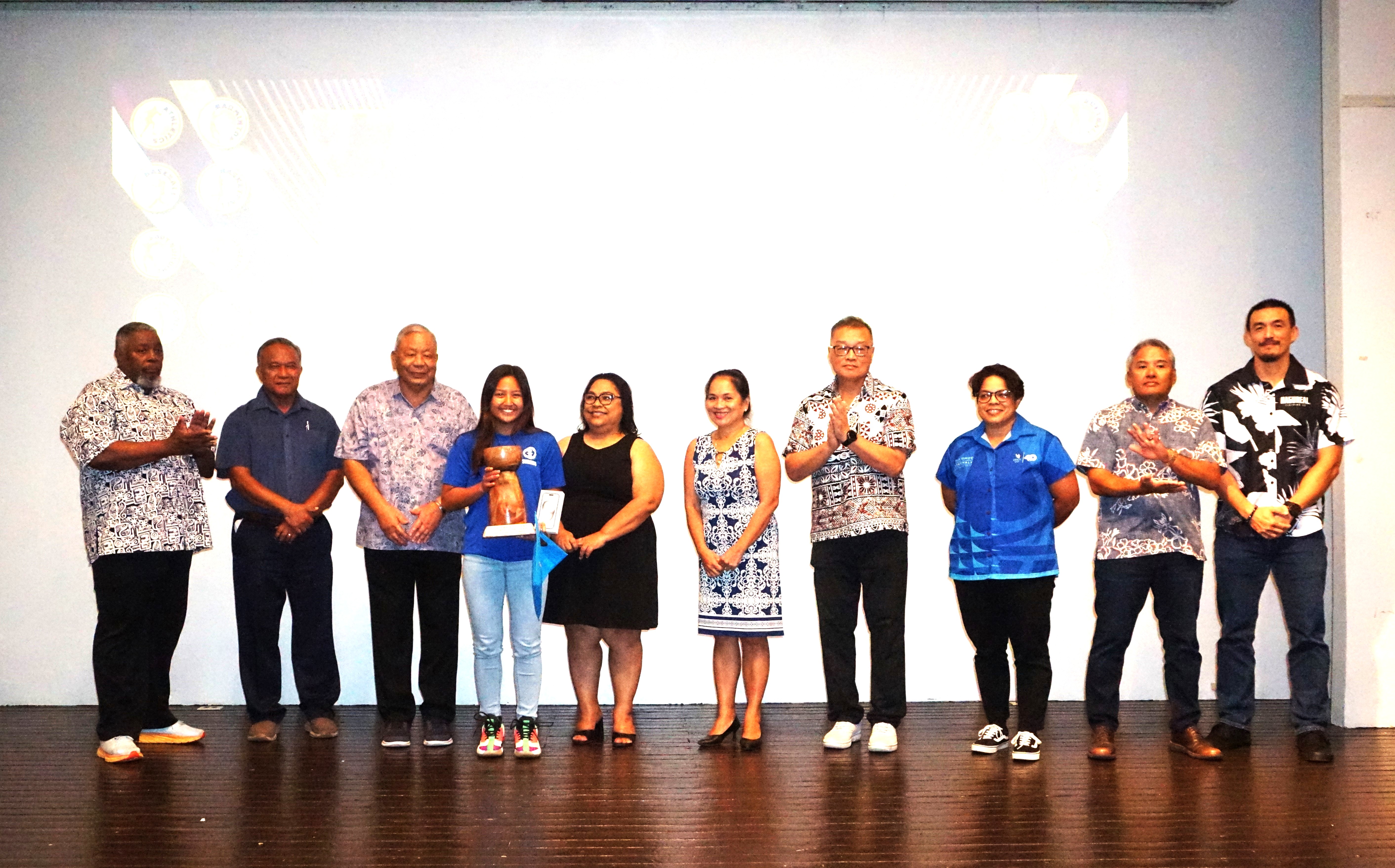 Maria Battalones poses with the Female Student Athlete of the Year Award alongside NMSA officials during the Northern Marianas Sports Association annual awards banquet and 40th anniversary celebration at the Taga Hall of Crowne Plaza Resort Saipan on Thursday.