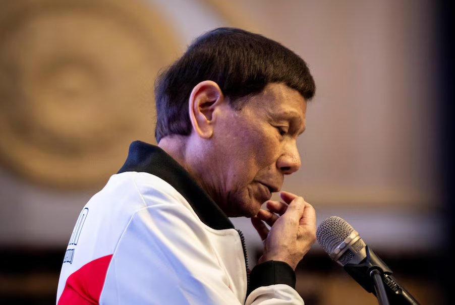 Former Philippine President Rodrigo Duterte gestures as he delivers a message during the proclamation rally for his political party PDP-Laban's senatorial candidates ahead of the midterm elections, at Club Filipino in San Juan, Metro Manila, Feb. 13, 2025.REUTERS