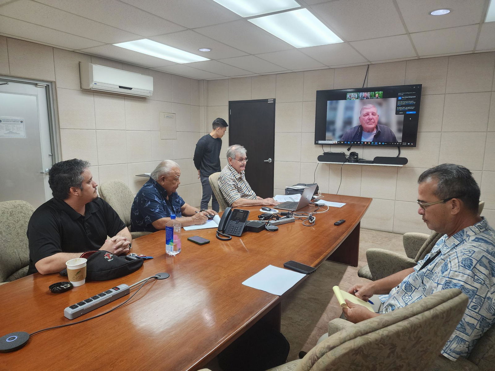 Commonwealth Public Utilities Commission members Jack Angelo, Bruce Camacho, Oscar Quitugua, and James Sirok (via Zoom) meet in the Commonwealth Economic Development Authority conference room on Thursday.Photo by Bryan Manabat