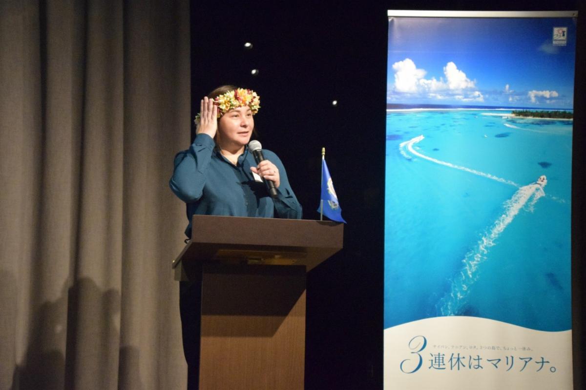 Marianas Visitors Authority Managing Director Jamika R. Taijeron gestures to her “mwar” while addressing nearly 60 attendees of the Marianas Seminar held on March 18, 2025, in Tokyo.MVA photo