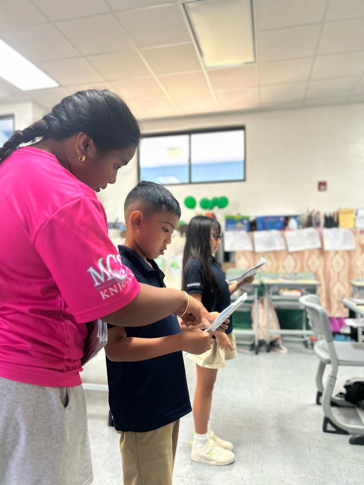 Quimari Duenas rehearses a scene from William Shakespeare’s “As You Like It” with third grade students ahead of the Mount Carmel School Theatre Club production of “3 (Mini) Plays by Shakespeare” on Friday, March 28, and Saturday, March 29, at the school’s library.MCS photo